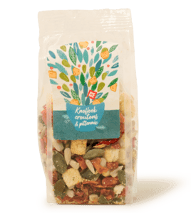 Salademix zonnebloempitten, pompoenpitten, tomatenvlokken en knoflookcroutons